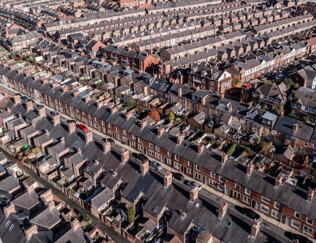 Aerial view of rows of back to back terraced house in a UK city
